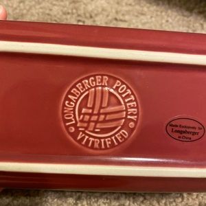 Longaberger paprika loaf pan.  Never baked in.